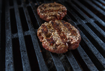 burger patties grilled on grill 
