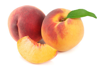 peach fruit with green leaf and slices isolated on white background