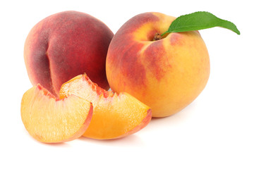peach fruit with green leaf and slices isolated on white background