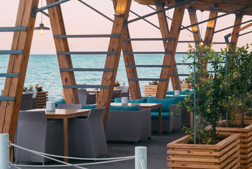 A street cafe with tables and a terrace by the sea. Black Sea. 
