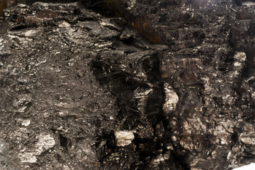 structure of coal stones, the texture of hard coal close-up