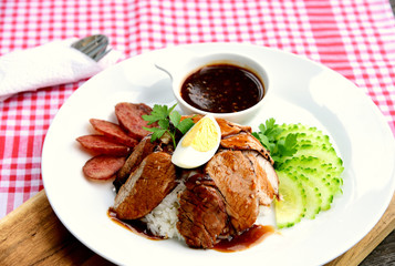 Barbecued red pork in sauce with rice..Thai Pork Menu.