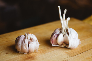 close up the garlic on a wooden cutting board