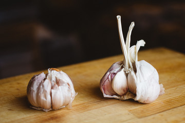 close up the garlic on a wooden cutting board