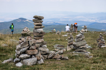 Stones stacked on top of a mountain. The summit in central europe.