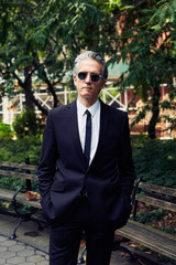 Grey Haired Caucasian Man Dressed in Contemporary Black Suit for Business, Executive