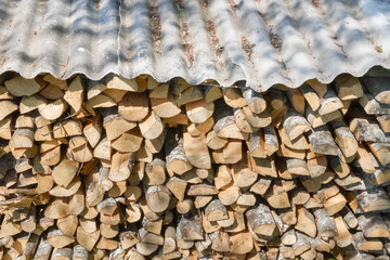 The wood chopped up are in a stack