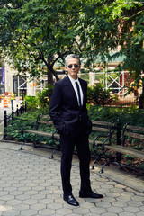 Grey Haired Caucasian Man Dressed in Contemporary Black Suit for Business, Executive