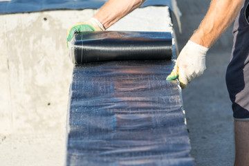 Waterproofing of the Foundation for the construction of a house made of wood.