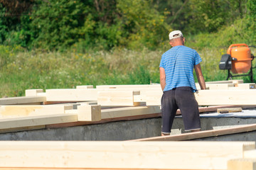 Construction of a wooden house of laminated veneer lumber.