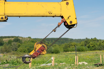 Jib crane on the sky background. Place for your text.