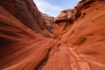 Scenic colorful canyon landscape with beautiful clouds in the sky. Beauty of American southwest. Slot canyon in Page, Arizona
