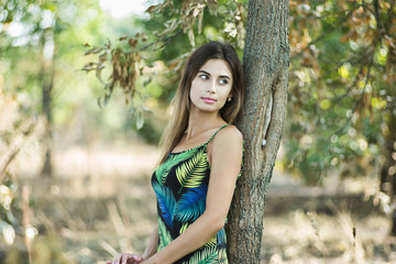 Fototapeta premium Portrait of young gorgeous lady with green lives, close up, shallow depth of field