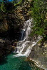 waterfall in the mountains among the rocks