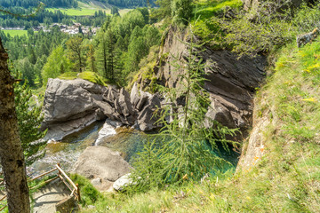 Fototapeta premium waterfall in the mountains among the rocks