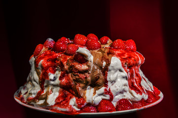 Homemade strawberry cake isolated on dark background