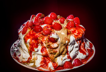 Homemade strawberry cake isolated on dark background