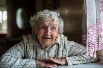 Portrait of cheerful elderly woman.