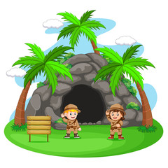 two adventurer in front of cave