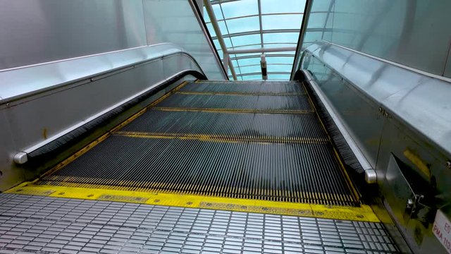 Moving escalator up, mecanic, electic. Stairs and escalators in a public area. 4K