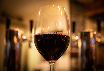 Glass of Red Wine at a Bar