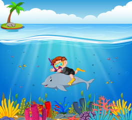 Naklejka na ściany i meble Cartoon boy diving in the sea with dolphin