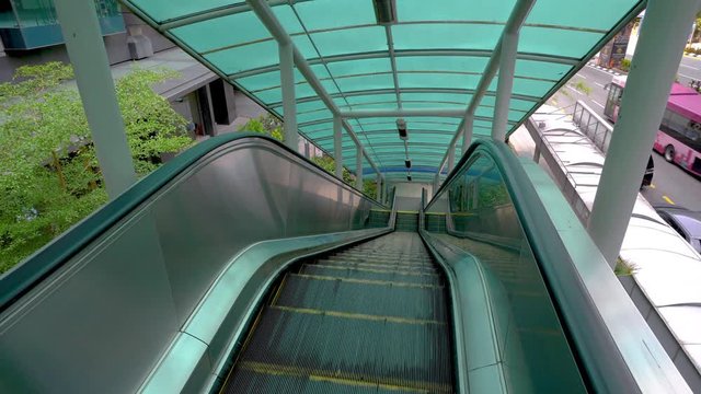 Moving escalator up, mecanic, electic. Stairs and escalators in a public area. 4K