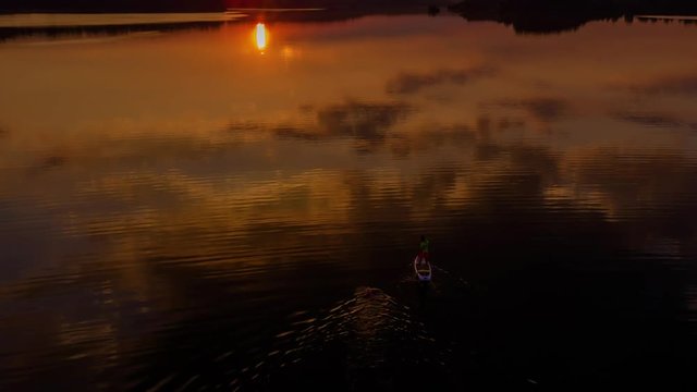Reflection of orange sunrise at the lake