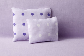 Purple spotted cusions on sofa