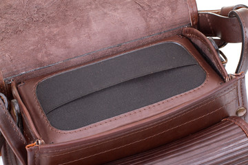 Leather hunting bag with brown ornament with patronage on white isolated background