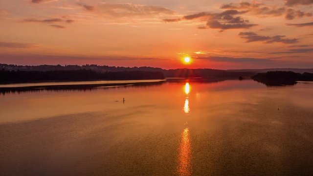 Orange sunrise with water
