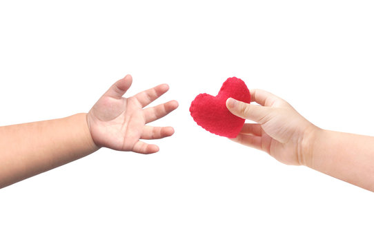 Baby's hands giving and taking a red heart isolate on white