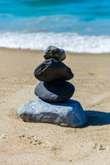 Fototapeta na wymiar Rock Cairn on a Beach
