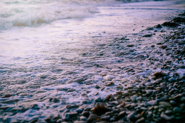 seaside pebbles washed by the waves.