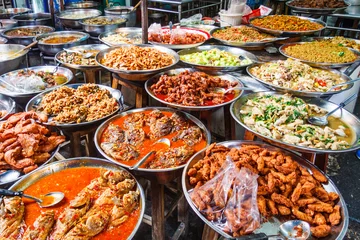 Fotobehang Platters of traditional Thai food © Kevin Hellon