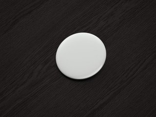 Fototapeta na wymiar White blank pin button on dark wooden background, 3d rendering.
