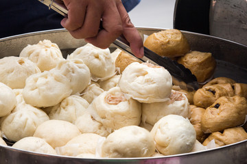 Chinese steamed pork buns on a street food stall in CHinatown, Bangkok