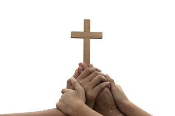 human hands praying to the GOD while holding a crucifix symbol with bright sunbeam on white...