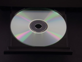 Silver CD or DVD in an Ejected Tray of a Multimedia Player