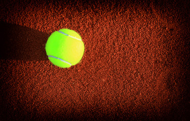 Tennis balls on a tennis clay court