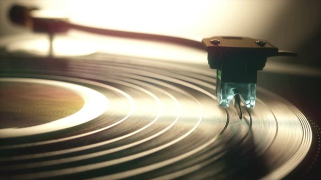 Vinyl record being played on old retro vintage disc jockey device.