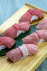 chuoro and Otoro tuna sushi set on the wooden table, healthy Japanese food concept