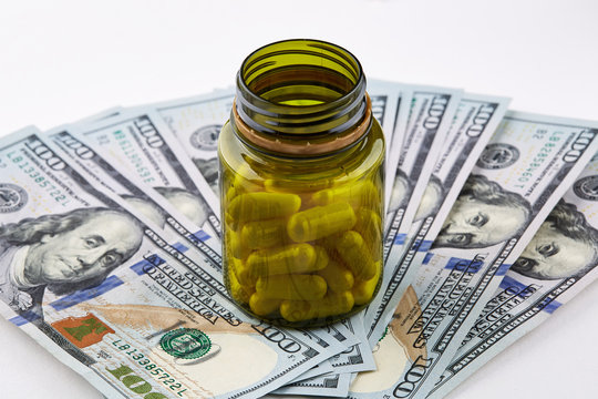 White pills in gallipot on american dollars banknote.