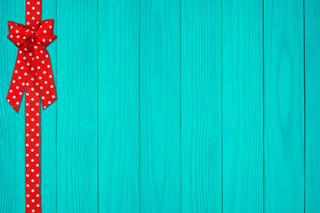 Gift box on an old dark wooden table. Christmas and other holidays concept, top view with copy space.