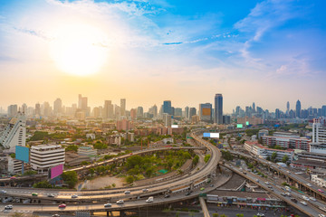 Naklejka na ściany i meble Bangkok skylines and highway traffic motion of urban in the sunset to night.