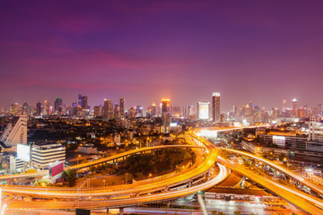 Fototapeta na wymiar Bangkok skylines and highway traffic motion of urban in the sunset to night.