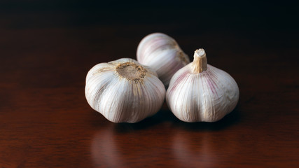 garlic cloves on wooden table
