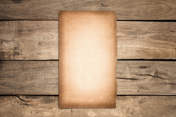 Old blank paper put on vintage wood background.