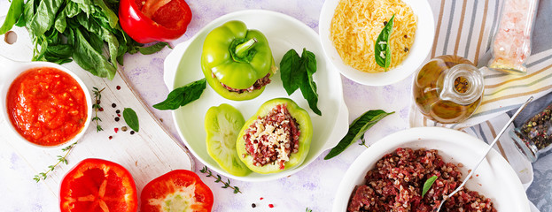 Ingredients for preparation of stuffed pepper with minced meat and buckwheat porridge. Tasty food. Flat lay. Top view. Banner