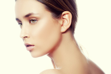 Fototapeta premium Beautiful young caucasian girl with natural makeup profile. Woman portrait. Toned image